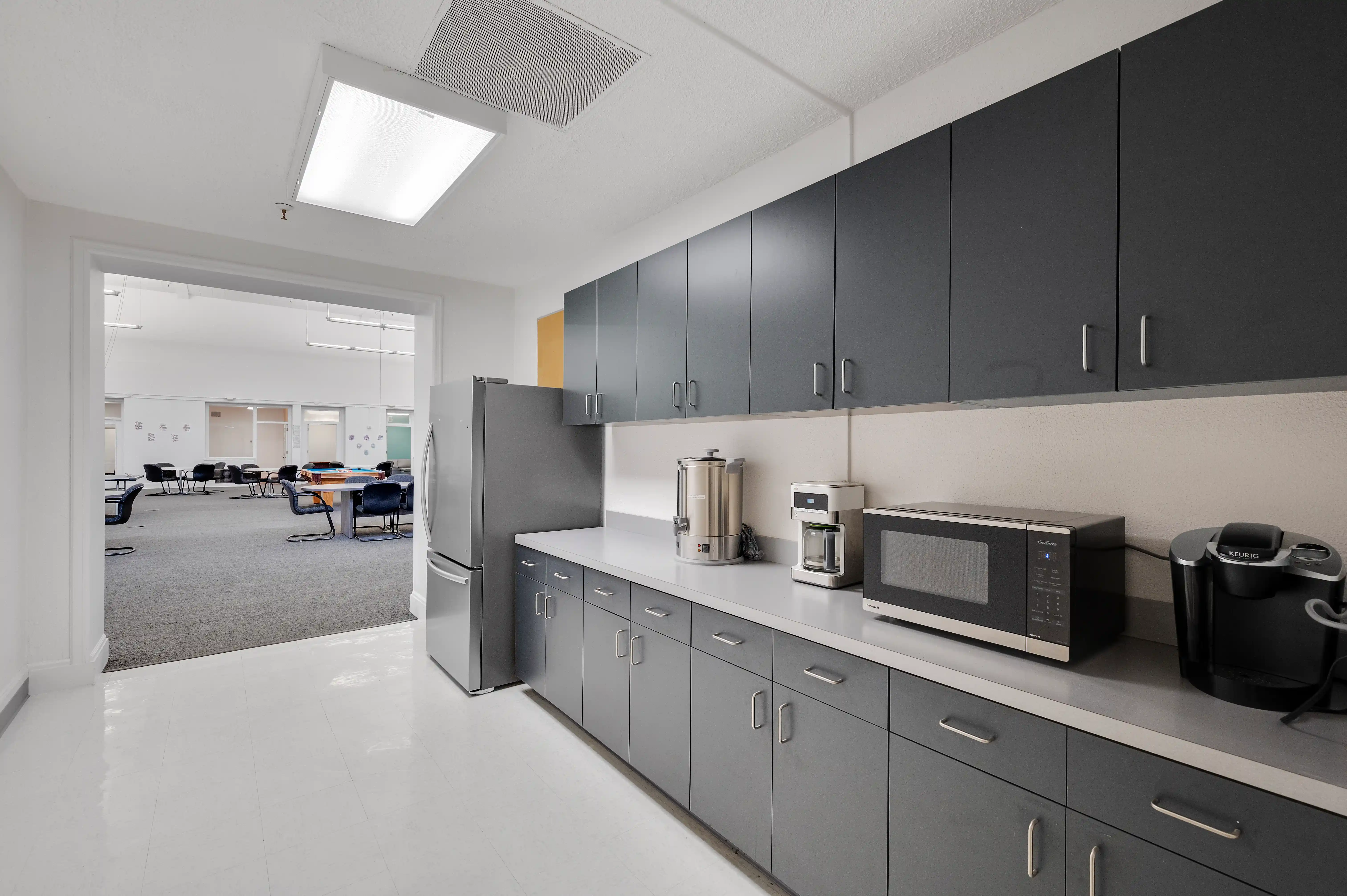 Break room kitchen with Keurig, microwave, and coffee urn at Atlas Treatment Center